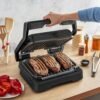 جهاز الشواء الكهربائي 2 في 1 Tefal لتحضير السندويشات و اللحوم بقوة 2100 واط مع فتح 180° و 09 برامج و نظام طهي تلقائي – OptiGrill GC772810 جهاز الشواء الكهربائي 2 في 1 Tefal لتحضير السندويشات و اللحوم بقوة 2100 واط مع فتح 180° و 09 برامج و نظام طهي تلقائي – OptiGrill GC772810 DariTek