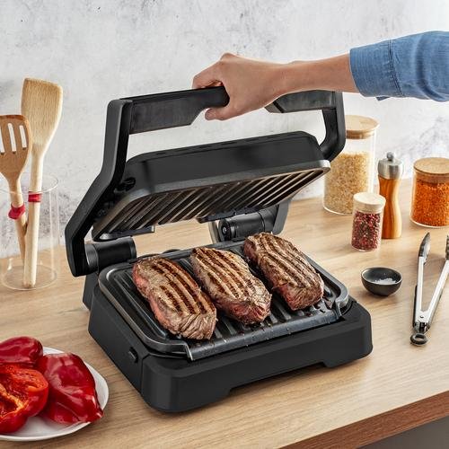 جهاز الشواء الكهربائي 2 في 1 Tefal لتحضير السندويشات و اللحوم بقوة 2100 واط مع فتح 180° و 09 برامج و نظام طهي تلقائي – OptiGrill GC772810 جهاز الشواء الكهربائي 2 في 1 Tefal لتحضير السندويشات و اللحوم بقوة 2100 واط مع فتح 180° و 09 برامج و نظام طهي تلقائي – OptiGrill GC772810 - الصورة 4